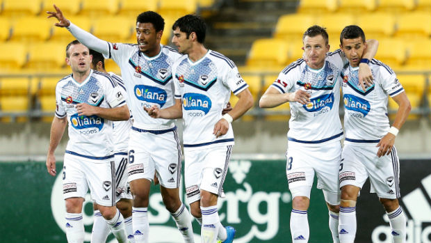 Melbourne Victory players celebrate opening the scoring against the Phoenix at Westpac Stadium.