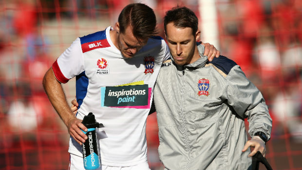 Newcastle Jets captain Nigel Boogaard leaves Coopers Stadium after picking up an injury.