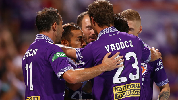 Glory players celebrate a goal in their 4-0 win over Central Coast Mariners.