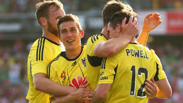 Wellington Phoenix players celebrate one of Blake Powell's four goals against the Wanderers.