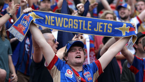 Newcastle Jets fans get behind their team during their Round 2 clash against Sydney FC.