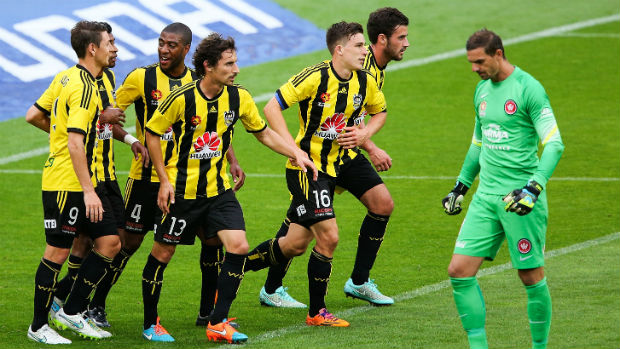 Wellington players congratulate Roy Krishna after the scored against the Wanderers.