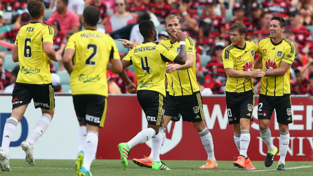Wellington celebrate one of Blake Powell's three first-half goals against the Wanderers on Sunday.