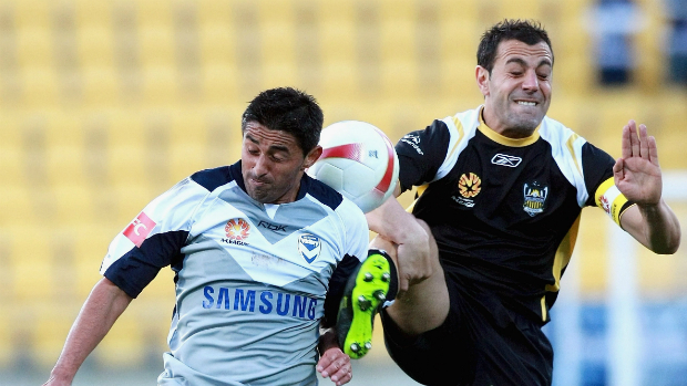 Wellington Phoenix captain Ross Aloisi and Carlos Hernandez battle for the ball in Phoenix's first-ever A-League game.