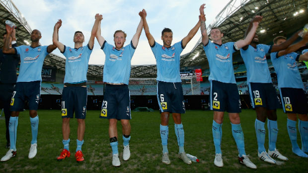 Sydney FC players celebrate their Round 14 win over the Jets at Allianz Stadium.