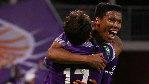 Jamal Reiners and Diego Castro celebrate combining for Glory's decisive goal against Victory.